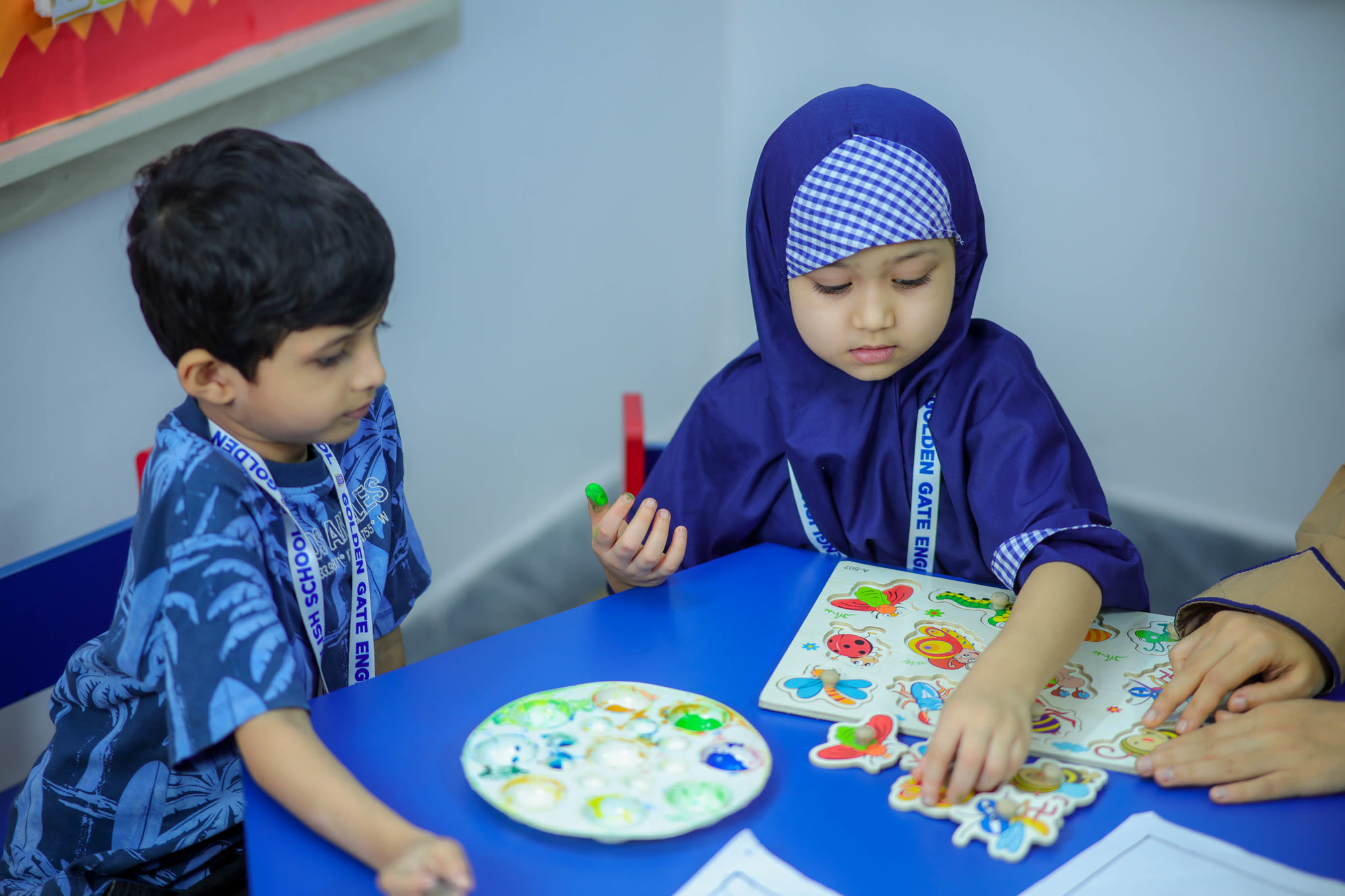 Young students learning together in a bright classroom