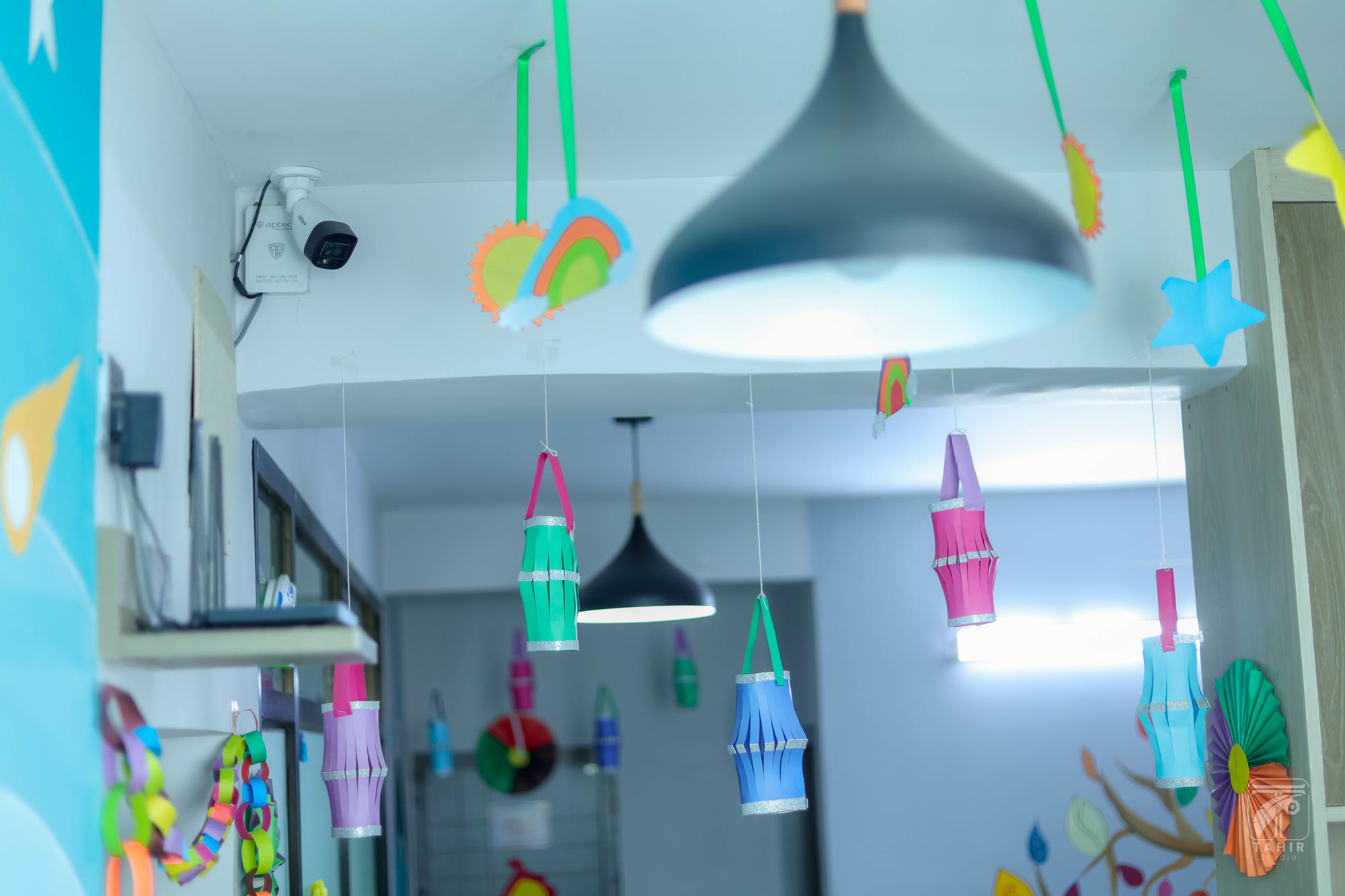 Bright school classroom with desks and learning materials